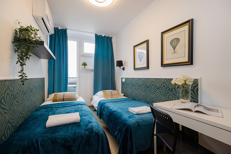 Apartament na krótkoterminowy wynajem w centrum Warszawy, pokój dla 2 osób z szybkim Wi-Fi, oferta UnitApartments