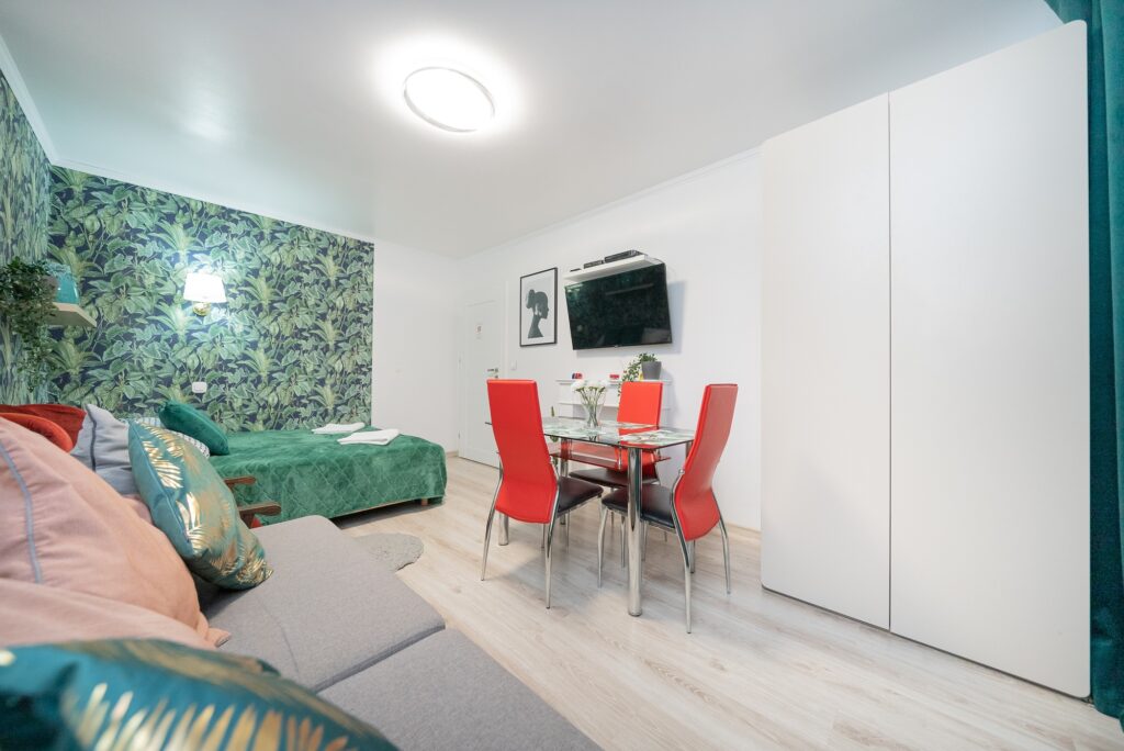 Modern apartment in Warsaw city center with cozy room featuring a TV, stylish decor, and comfortable living space