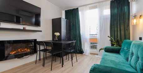 Cozy modern apartment room in central Warsaw with TV